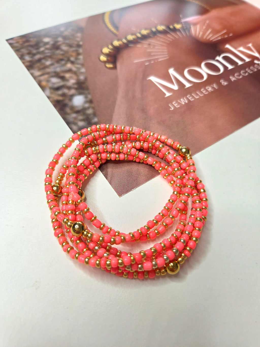 Elastische armband koraal