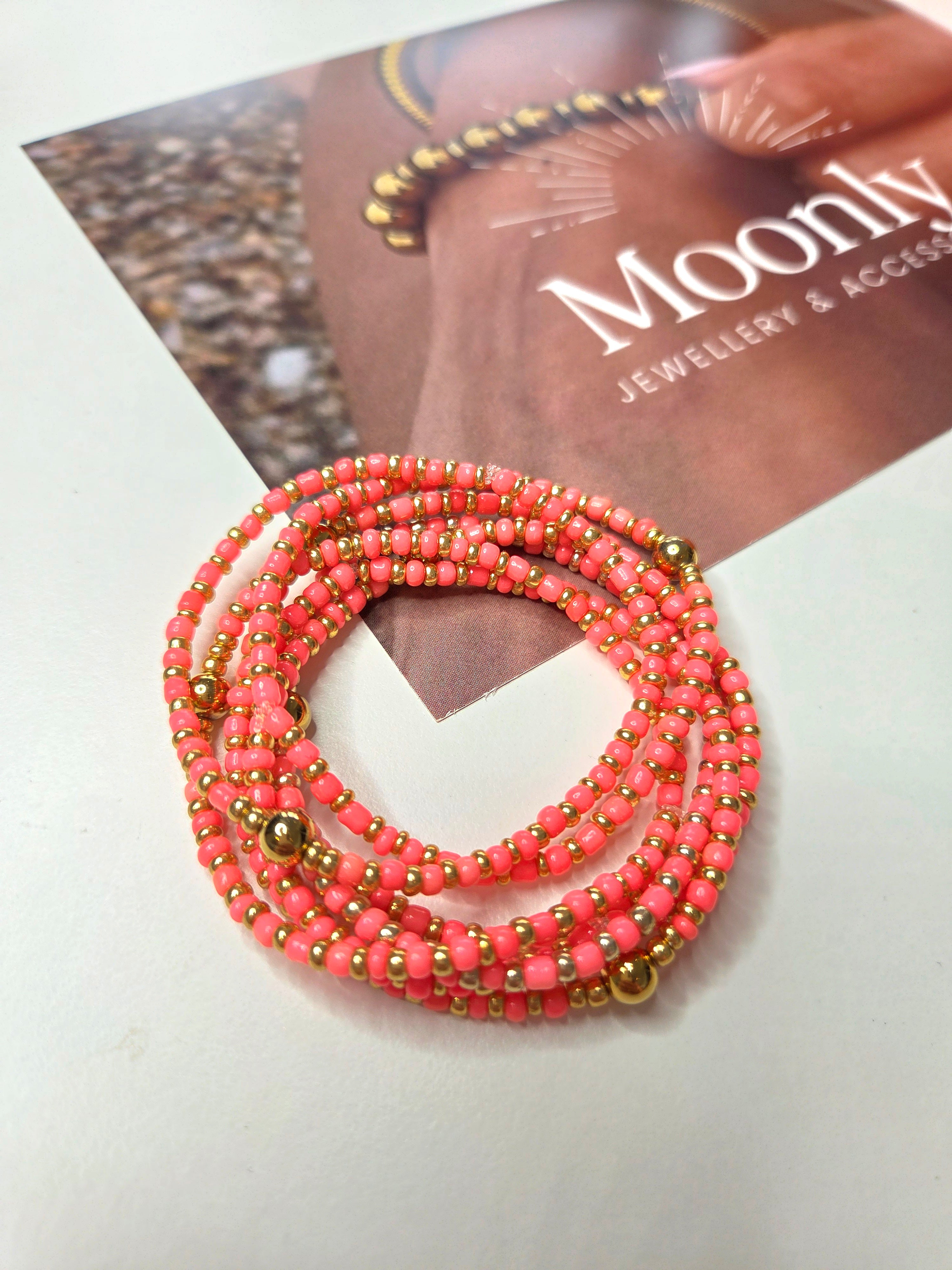 Elastische armband koraal