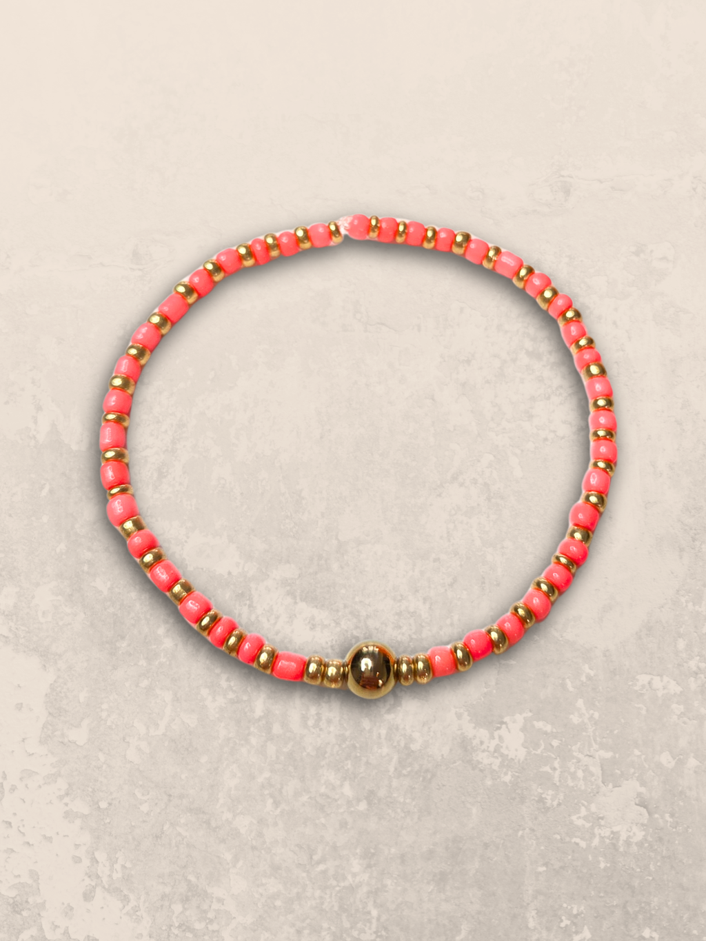 Elastische armband koraal